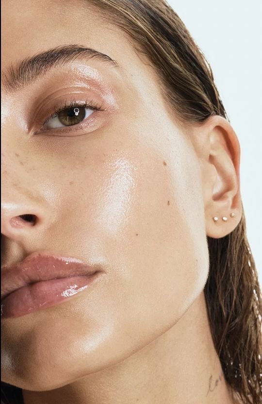 Hailey Bieber close-up highlighting skin appearance in an article exploring sugar, collagen and skin health