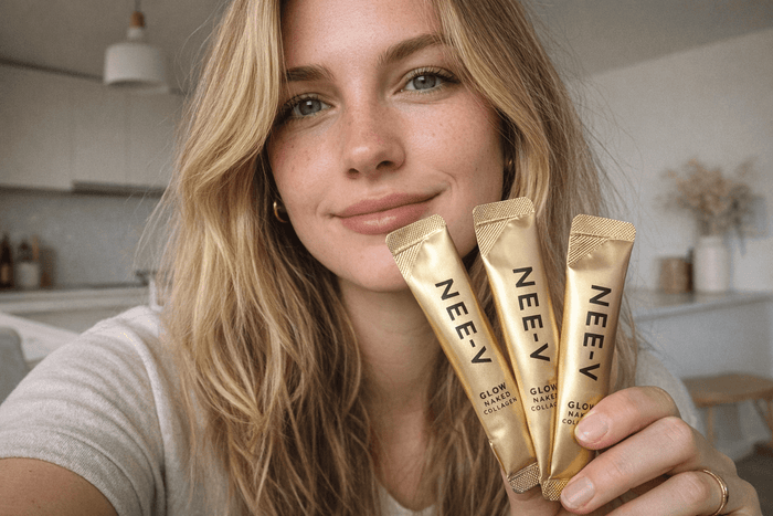 Woman holding NEE-V collagen sachets as part of a daily skin health and healthy ageing routine