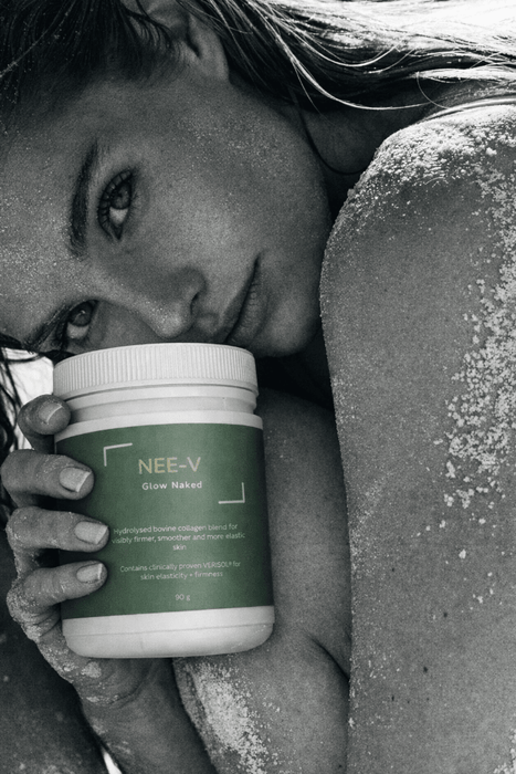 Woman holding NEE-V Glow Naked VERISOL® collagen powder for skin health and healthy ageing