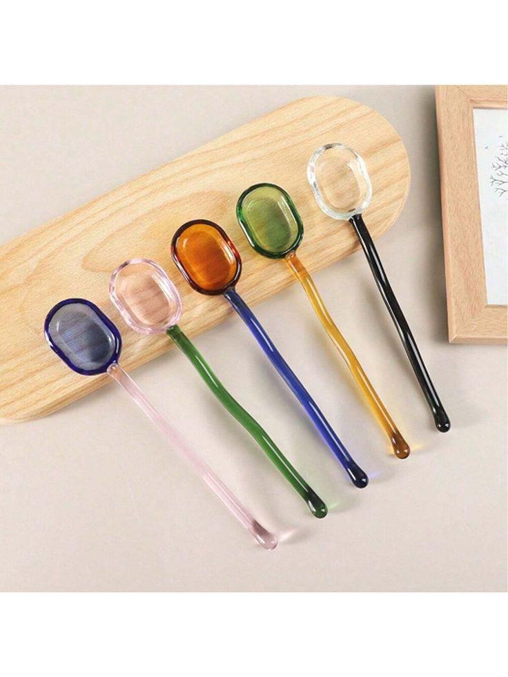 The NEE-V Glass Spoon Collection (sold individually).