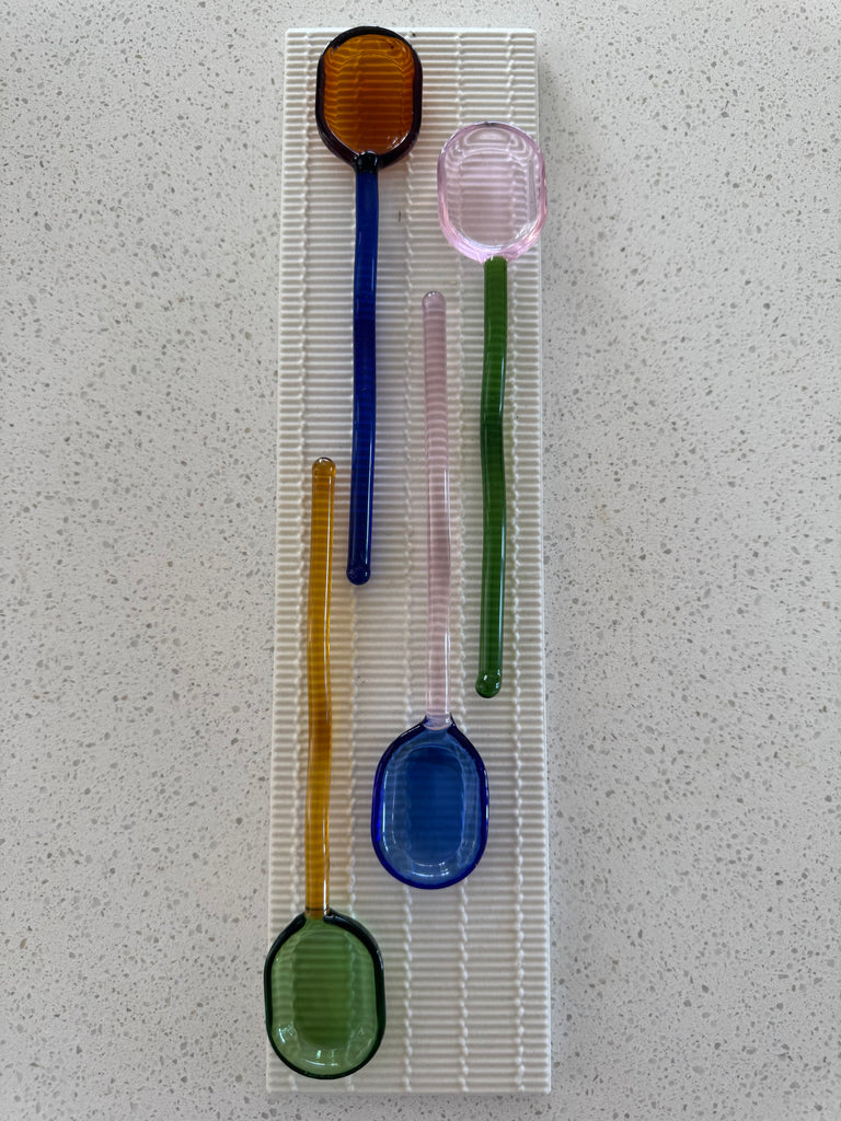 The NEE-V Glass Spoon Collection (sold individually).