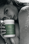 Person holding a container labeled 'NEE-V' in a close-up shot.