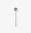 Antique gold measuring spoon used with NEE-V collagen supplements as part of a daily wellness ritual.